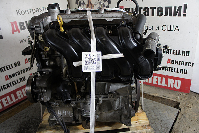 Двигатель вид с боку Toyota 2NZ-FE