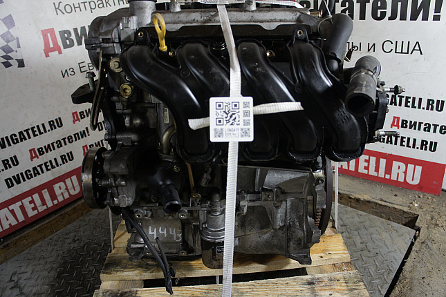 Двигатель вид с боку Toyota 2NZ-FE